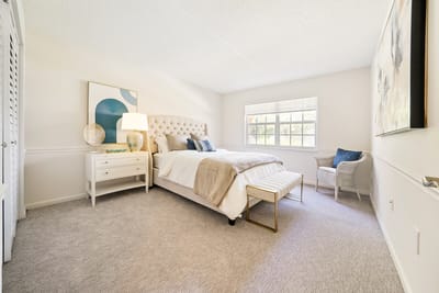 Brightly decorated private resident room with a bed