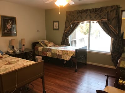 Private resident room with beds and natural light