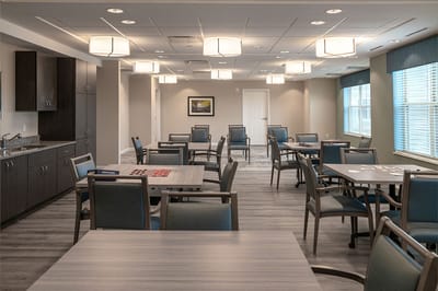 Bright common area with tables and chairs