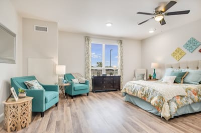 Brightly furnished resident room with cozy decor