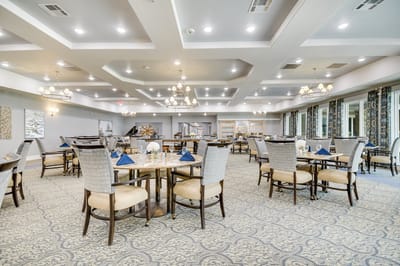 Brightly lit dining room with elegant table settings