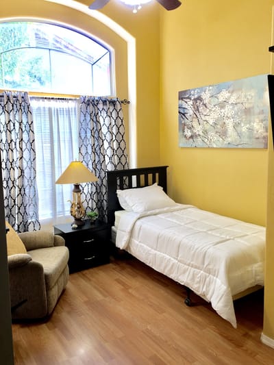 Private resident room with a bed and window