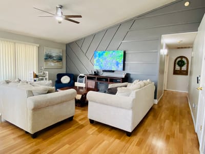 Cozy common area with comfortable seating and TV