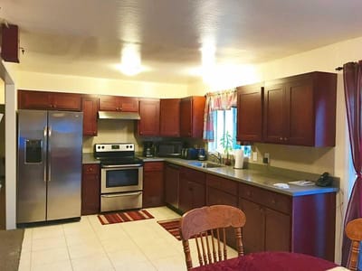 Bright kitchen area with wooden cabinets and modern appliances