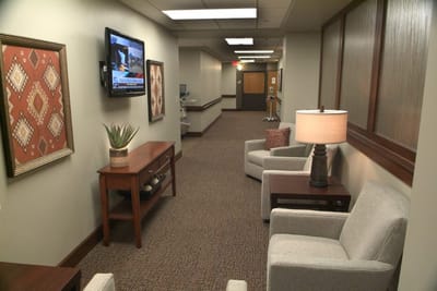 Well-lit common area with seating and decor