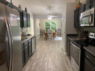 Bright kitchen space with dining area visible