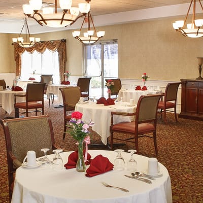 Dining area with tables set for meal service