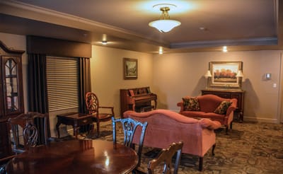 Cozy lounge area with seating and piano