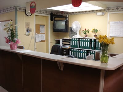Reception area with flowers and office supplies