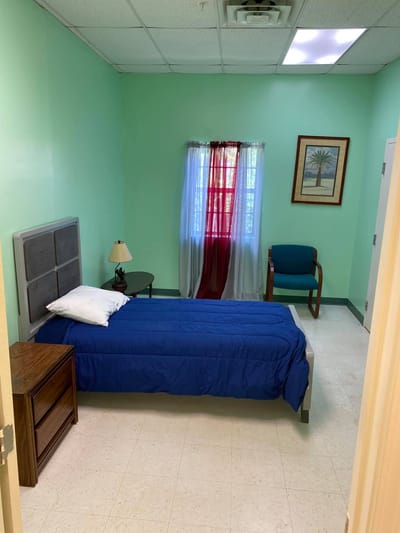 A private resident room with a bed and furnishings