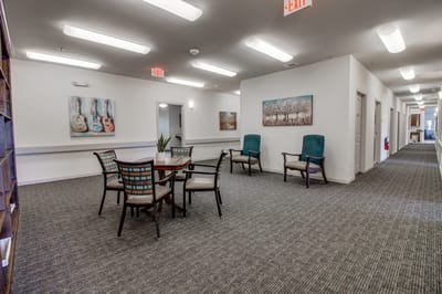 Bright common area with seating and artwork