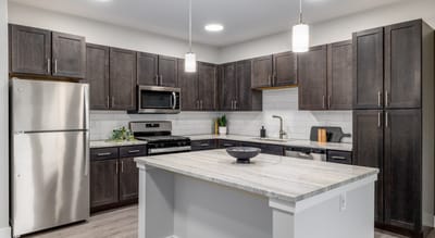 A modern kitchen layout with cabinetry and appliances