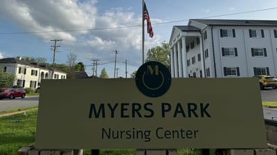 Sign of Myers Park Nursing Center with building in background