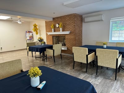 Interior view of a common area with tables and chairs