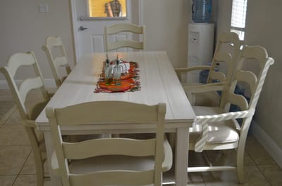 Dining area with a large table and chairs.