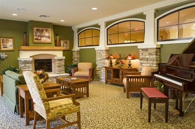 Common area with seating and piano in the facility