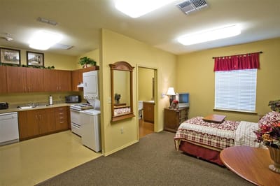 Interior view of a resident room with kitchenette