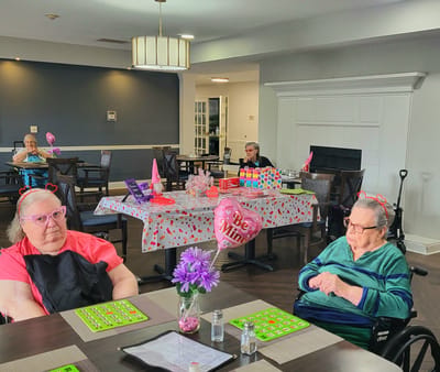 Residents enjoying a bingo game in the common area