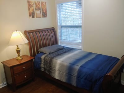 Cozy bedroom setup with a bed and lamp