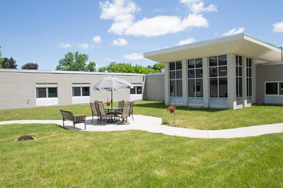 Outdoor patio area with seating and umbrellas