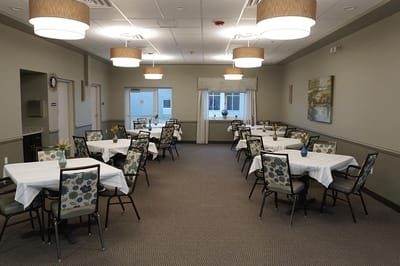 Interior dining area with set tables and chairs