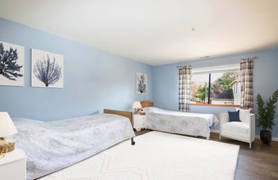 Cozy resident room with two beds and window