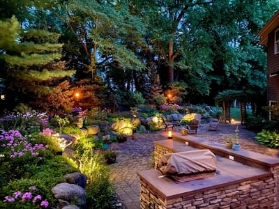 Beautifully lit garden pathway with flowers
