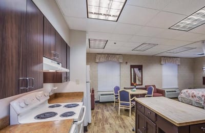 Bright interior view of a resident room with kitchen area