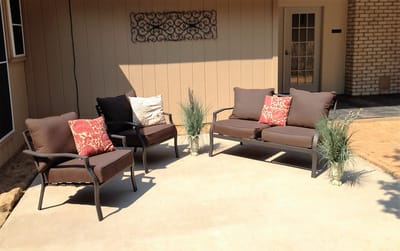 Cozy outdoor seating area with couches and plants