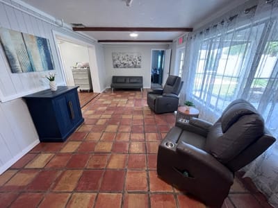 Bright interior common area with seating and large windows