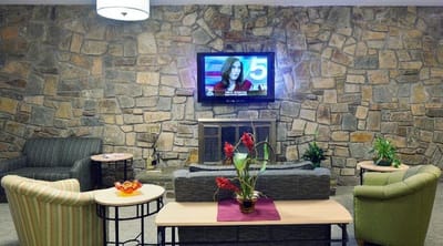 Cozy common area with seating and a television