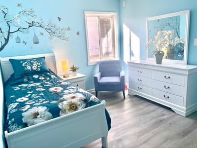 Cozy resident room with a bed and seating area