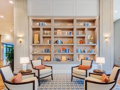 Interior common area with seating and bookshelves