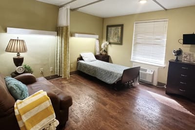 Interior view of a private resident room with furnishings
