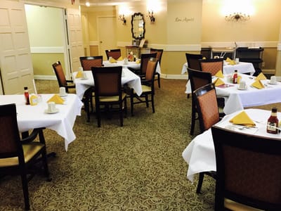 Dining room setup with neatly arranged tables