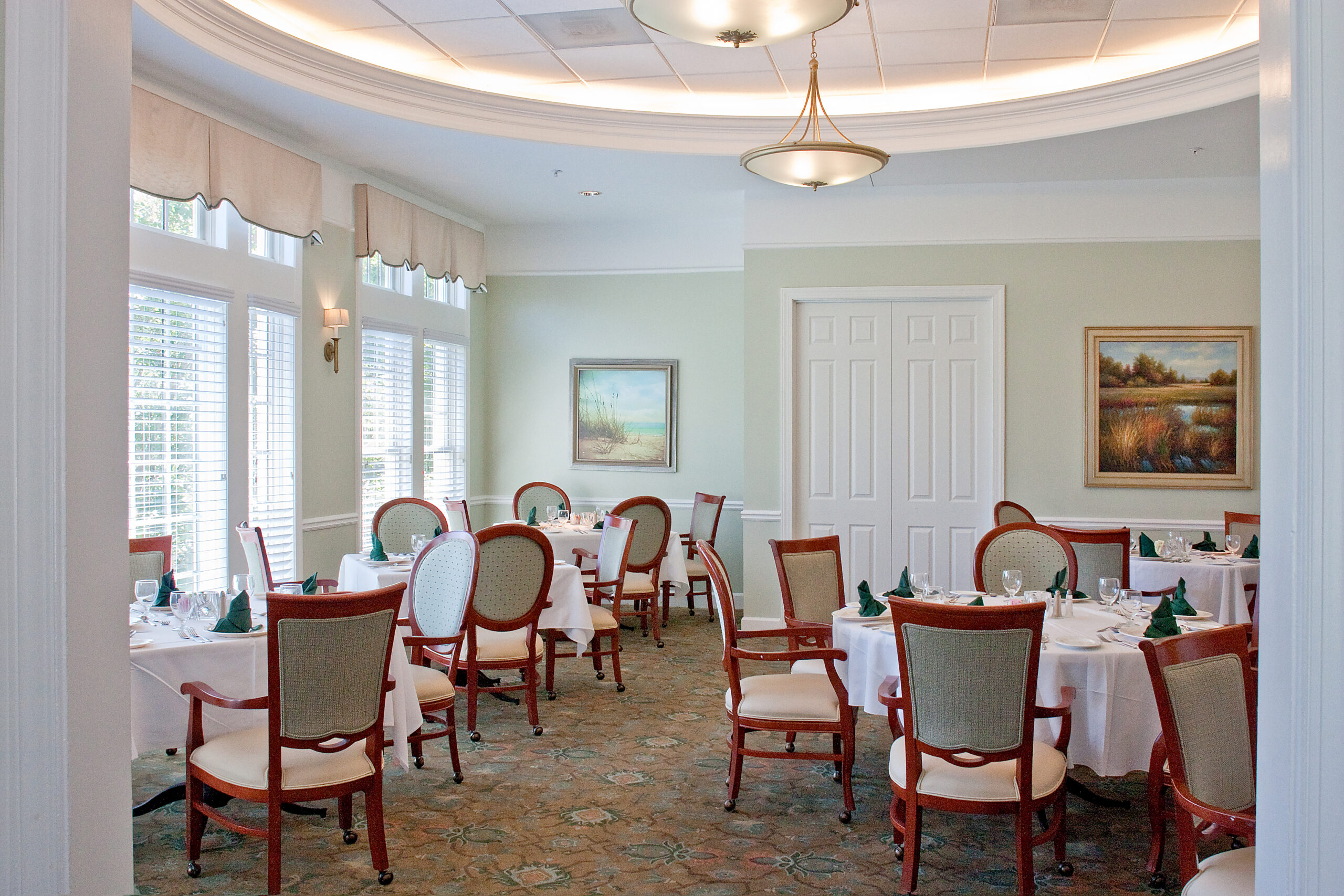 Elegant dining room setup with tables and chairs