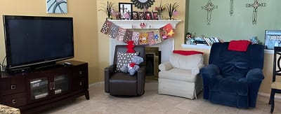 Cozy living room area with chairs and decorations