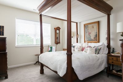 Cozy bedroom interior with a four-poster bed