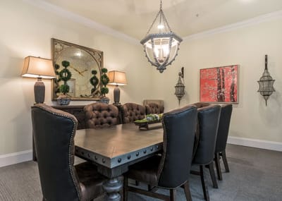 Elegant dining area with a large table and decorative lighting