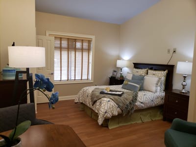 Cozy private room with bed and decorative elements