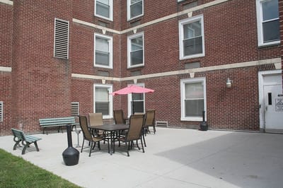 Outdoor patio area with seating and umbrella