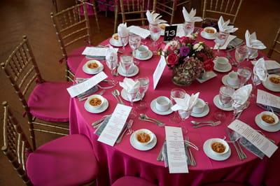 Beautifully set dining table for an event with floral centerpiece
