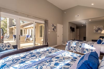 Bright resident room with floral bedding and outdoor view