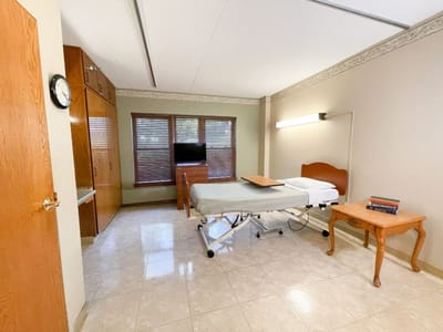 Private resident room with a bed and furniture