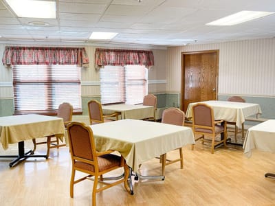 Interior view of a common activity room with tables