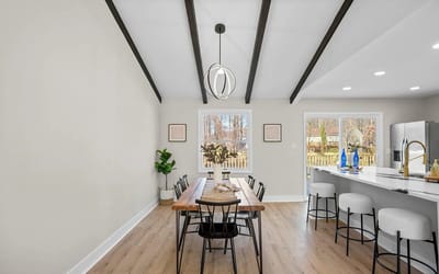 Bright interior common area with dining table and kitchen