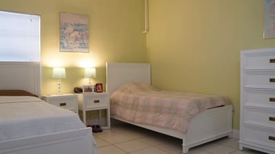 Private resident room with twin beds and decor