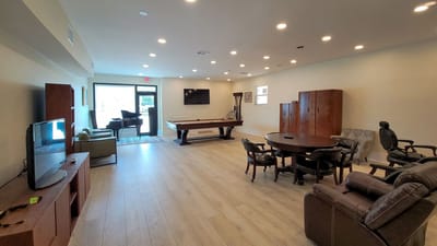 Common area with seating and a pool table