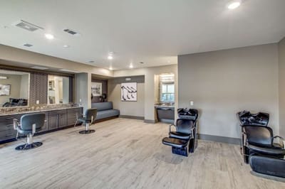Interior of a salon with styling chairs and mirrors