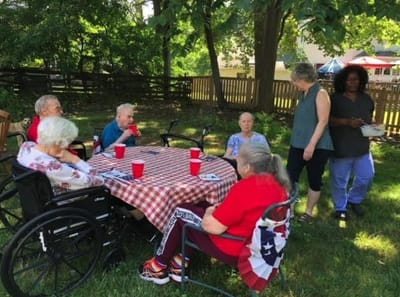 Residents enjoying an outdoor gathering in a garden area
